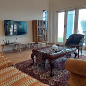 TV a/nebo společenská místnost v ubytování TM 16 Padang, Near Mentawai Fast & City Center