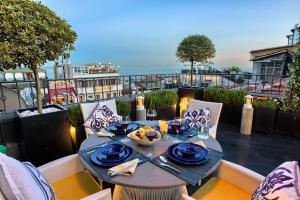 a table with a bowl of food on a balcony at Istanbul Irini Seaview House in Istanbul