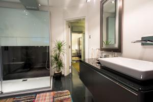 a bathroom with a white sink and a mirror at Istanbul Irini Seaview House in Istanbul +17 photos
