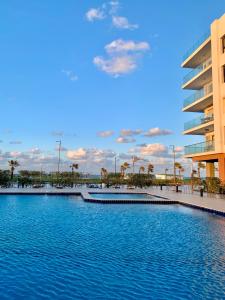 a large pool of water in front of a building at Porto Said chalet for rent بورتوسعيد بورتو سعيد in Port Said