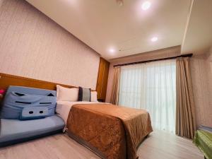 Säng eller sängar i ett rum på Ibizakenting Hotel