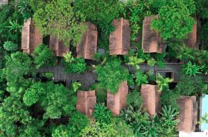 an overhead view of a garden with trees and plants at Outpost Ubud Bungalows in Ubud