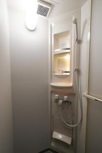 a small bathroom with a shower and a toilet at ZENYA - Vacation STAY 89352v in Nakano