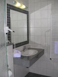 Um banheiro em Waldhotel