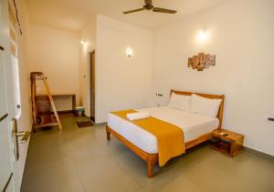Postel nebo postele na pokoji v ubytování Ocean View Beach Villa Varkala by VOYE HOMES