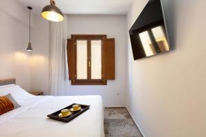 A bed or beds in a room at The Old Town Gem