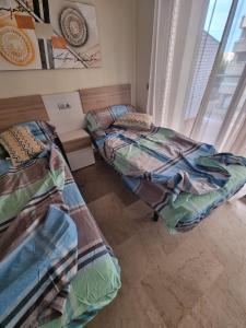 Postel nebo postele na pokoji v ubytování Sol en la plaja