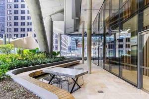 a table in the middle of a building at Luxury Stay in Sydney CBD in Sydney