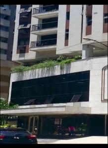 a building with plants on the side of it at Apart hotel plaza Elysées in Rio de Janeiro