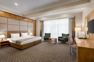 سرير أو أسرّة في غرفة في Wyndham Baku