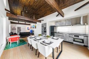 a kitchen and dining room with a table and chairs at VILLA ROCHALIE by Hakuba Hotel Group in Hakuba