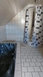 a large bathroom with a tub and a shower at Gästehaus Yvonne Sigg in Rust +2 photos