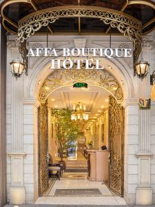 an entrance to a boutique hotel with a sign that reads atfa boutique hotel at Affa Boutique Hotel in Hanoi