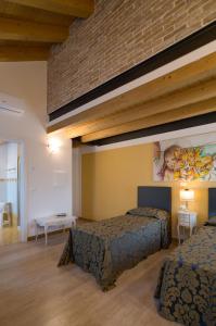 Postel nebo postele na pokoji v ubytování Cadifiore B&B