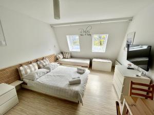 a small bedroom with a bed and a desk at Apartment TiSa, Bovec in Bovec