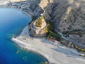 an aerial view of a small island in the ocean at Villa delle rose in Bova Marina