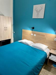 Ένα ή περισσότερα κρεβάτια σε δωμάτιο στο Hotel Kastoria 