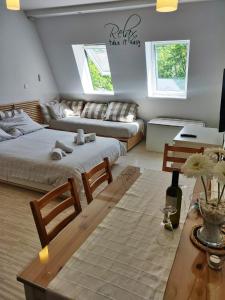 a living room with two beds and a couch at Apartment TiSa, Bovec in Bovec