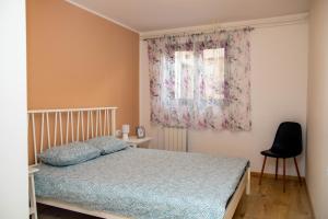 Postel nebo postele na pokoji v ubytování Apartment Fioretti + 37 fotografií