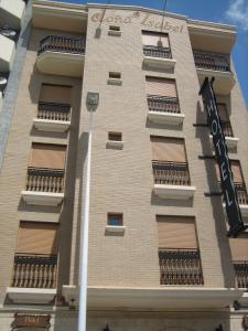 a tall building with balconies on the side of it at Hotel Doña Isabel in Torrellano