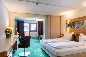 Postel nebo postele na pokoji v ubytování Hotel Sonnblick