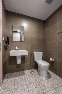 a bathroom with a toilet and a sink at Lacasita Near Beach Huahin (Room652) in Hua Hin