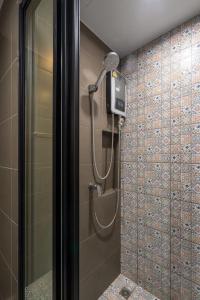 a shower in a bathroom with a shower at Lacasita Near Beach Huahin (Room652) in Hua Hin