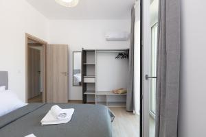 Postel nebo postele na pokoji v ubytování Villa Resperi