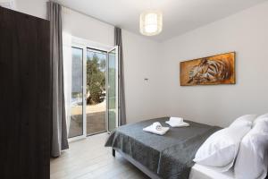 Postel nebo postele na pokoji v ubytování Villa Resperi