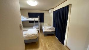 Krevet ili kreveti u jedinici u okviru objekta 富士山下Cottage-A