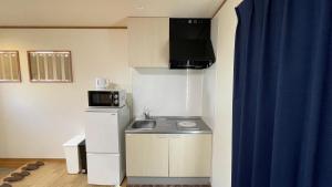 Kuchyň nebo kuchyňský kout v ubytování 富士山下Cottage-A + 5 fotografií