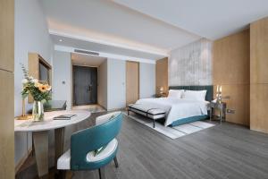 Qingdao Oriental Studio Chuangzhi SSAW Hotel 객실 침대