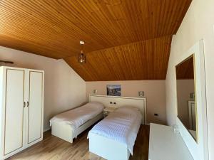 Letto o letti in una camera di Hotel Margjeka