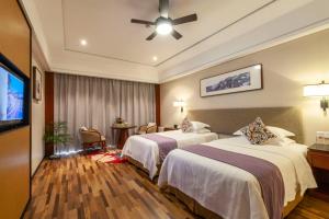 Luoxingge SSAW Boutiquel Hotel客房内的一张或多张床位