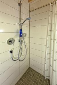 a shower in a bathroom with a shower curtain at Alb Fe Wo in Sankt Johann