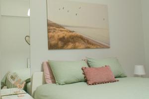 a living room with a couch and a picture on the wall at ALEX APARTMENT in Strovolos