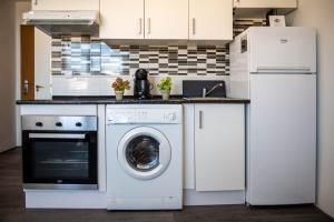 Kuchnia lub aneks kuchenny w obiekcie Casa Zoe - Apartamentos en Suite Budha - Buenas vibras! Edificio #LasNaciones