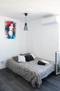 Łóżko lub łóżka w pokoju w obiekcie Casa Zoe - Apartamentos en Suite Budha - Buenas vibras! Edificio #LasNaciones