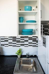 Kuchnia lub aneks kuchenny w obiekcie Casa Zoe - Apartamentos en Suite Budha - Buenas vibras! Edificio #LasNaciones
