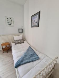 Łóżko lub łóżka w pokoju w obiekcie L'Ange gîte de groupe proche du Puy du Fou