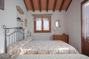 Giường trong phòng chung tại HelloElba Villetta Fiorita