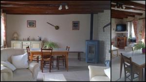 a kitchen and dining room with a table and chairs at Clé des champs in Antran +6 photos