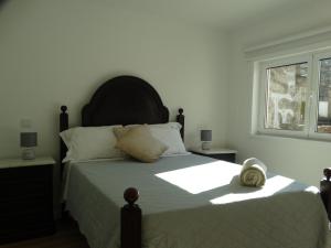 A bed or beds in a room at Casa da Barca