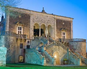 a large stone building with stairs in front of it at Cuore di Mandorla in Conversano