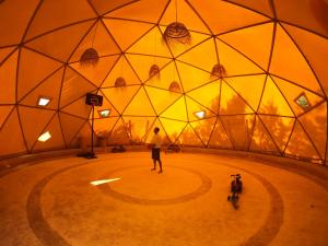 a person is standing in a dome with a bike at Yogam villa Essaouira in Al Ghar
