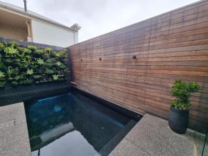a swimming pool in the backyard of a house at Stella on Stevens in Queenscliff