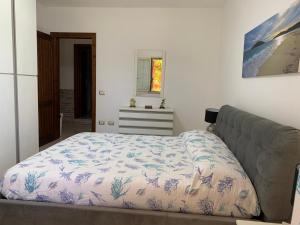 Posteľ alebo postele v izbe v ubytovaní Appartamento in Villa Gelsomino