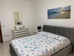Posteľ alebo postele v izbe v ubytovaní Appartamento in Villa Gelsomino