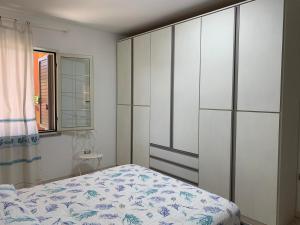Posteľ alebo postele v izbe v ubytovaní Appartamento in Villa Gelsomino