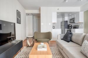 a living room with a couch and a table at Ballston 1br w wd gym pool nr Metro WDC-615 in Arlington